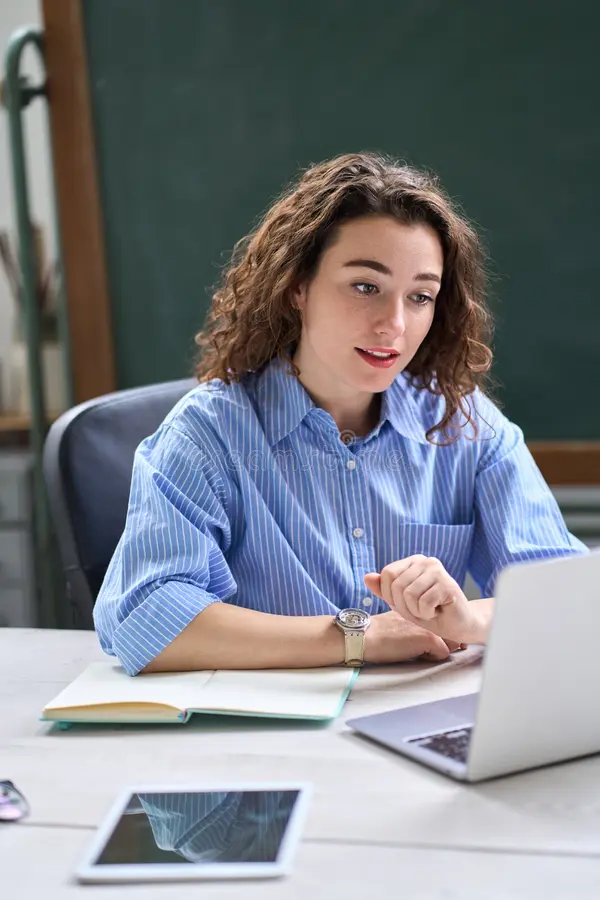 female online teacher teaching remote class distance working laptop virtual classroom young business woman manager talking 260785431